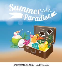 Summer Suitcase with Objects on Blur Background