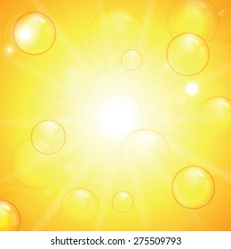 Summer sunny background.Transparent bubbles on a yellow background