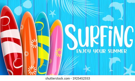 Summer surfing vector banner design. Surfing enjoy your summer text with colorful surfboard elements in blue wooden texture pattern background for beach water surf activity. Vector illustration 
