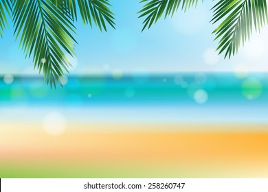 Summer time at the beach with coconut leaf on top and bokeh effect