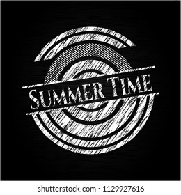 Summer Time chalk emblem written on a blackboard