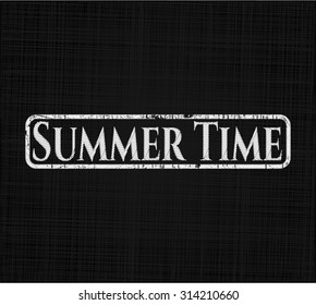 Summer Time chalk emblem written on a blackboard