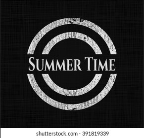 Summer Time chalk emblem written on a blackboard