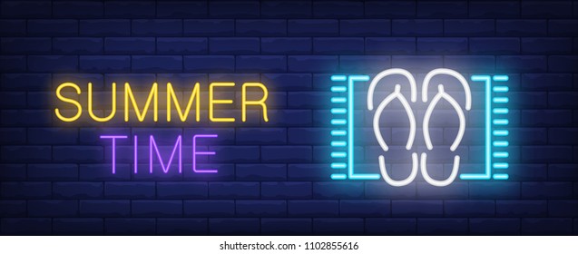 Summer time neon style lettering. Flip flops on beach mat on brick background. Beach, summer resort, vacation. Bright wall sign. Can be used for advertising, signboard, web design