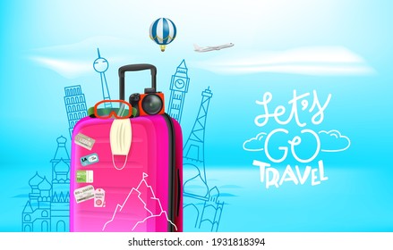 Summer travel concept with baggage, camera, protective mask. Lets go travel
