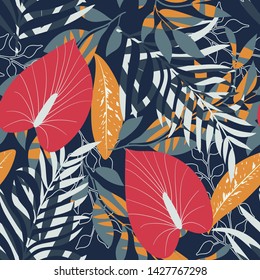 Summer trend seamless background with bright tropical leaves and plants on blue background. Vector design. Jungle print. Floral background. Printing and textiles. Exotic tropics. Summer design.