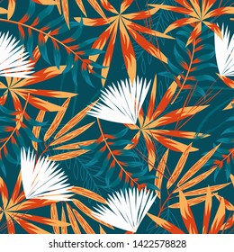 Summer trend seamless pattern with bright tropical leaves, plants and flowers on a dark green background. Vector design. Jung print. Floral background. Printing and textiles.