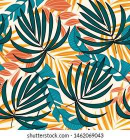 Summer trend seamless pattern with bright tropical leaves and plants on a light background. Vector design. Jungle print. Floral background. Printing and textiles. Exotic tropics. Summer design.