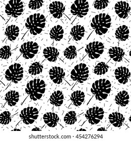 Summer tropical palm tree leaves seamless pattern on abstract confetti background. Vector grunge design for cards, wallpapers and natural product.