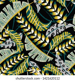 Summer tropical seamless pattern with bright leaves and plants on a black background. Vector design. Jungle print. Floral background.