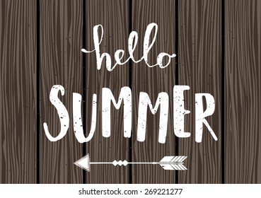 Summer typographic design in white on wooden planks background.