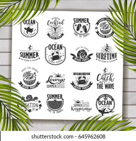 Summer Typography Design Collection - A set of sixteen vintage style Summer Designs on wooden background with palm leaves