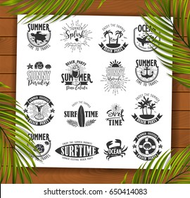 Summer Typography Design Collection - A set of sixteen vintage style Summer Designs on wooden background with palm leaves