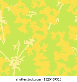 Summer UFO camouflage of various shades of green and yellow colors. It is a colorful seamless pattern that can be used as a camo print for clothing and background and backdrop or computer wallpaper