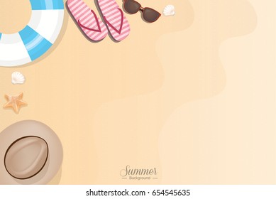 Summer vacation beach accessories on sand - top view with copy space