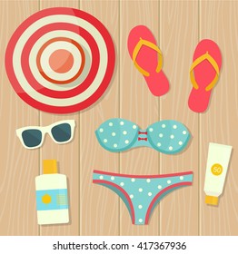 Summer vacation. Objects on wooden background. Top view. Vector flat illustration.