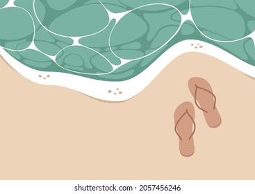 Summer vacation, a tropical beach top view, a pair of flip flops on the shore, sand and turquoise water