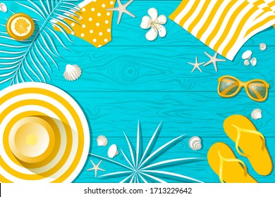 summer wardrobe items on wooden boards