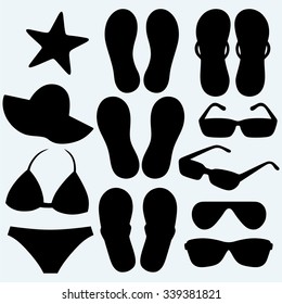Summer women accessories and shells. Isolated on blue background. Vector silhouettes