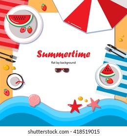 Summertime flat lay background. Summer picnic on the beach with watermelon, strawberry and coconut cocktail. It can be used in advertising, web design, graphic design for the layout.