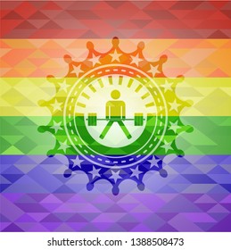 sumo deadlift icon inside emblem on mosaic background with the colors of the LGBT flag