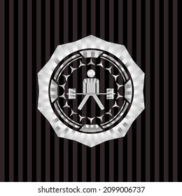Sumo-Totlift-Symbol in silbernem Emblem. 