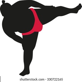 Sumo wrestler standing on one leg