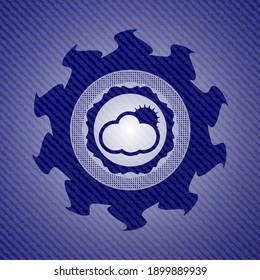 sun behind cloud icon with denim texture. 