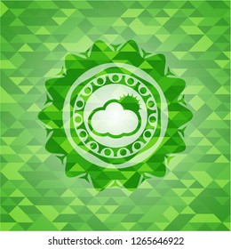 sun behind cloud icon inside green emblem with mosaic ecological style background