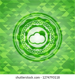 sun behind cloud icon inside green emblem. Mosaic background