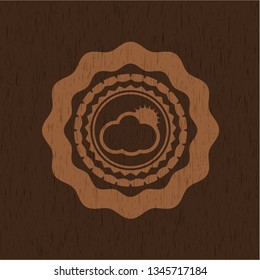 sun behind cloud icon inside wood emblem. Vintage.