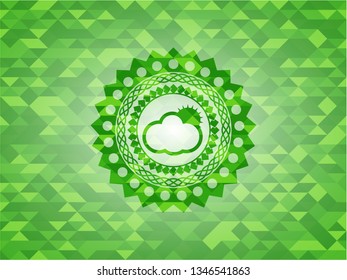 sun behind cloud icon inside green emblem with mosaic ecological style background