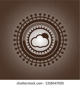 sun behind cloud icon inside wooden emblem. Retro