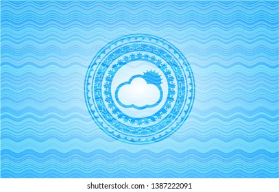 sun behind cloud icon inside light blue water badge background.