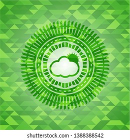 sun behind cloud icon inside green emblem with mosaic ecological style background