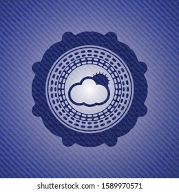 sun behind cloud icon inside emblem with jean background