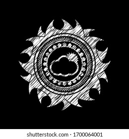 sun behind cloud icon inside chalkboard emblem on black board