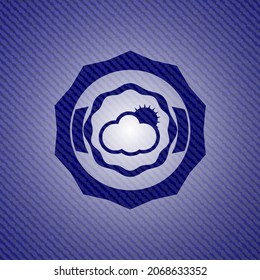 sun behind cloud icon with jean texture. 