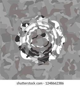 sun behind cloud icon on grey camo texture