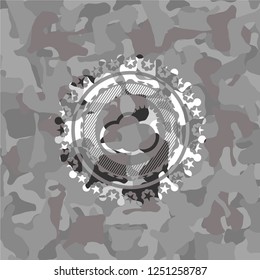 sun behind cloud icon on grey camouflaged pattern
