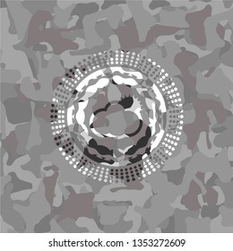 sun behind cloud icon on grey camo texture