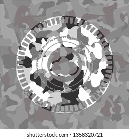 sun behind cloud icon on grey camo pattern