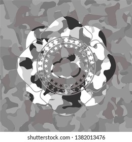sun behind cloud icon on grey camo pattern