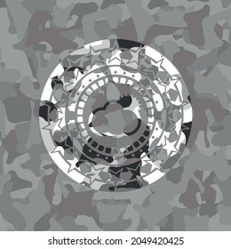 sun behind cloud icon on grey camo pattern. 