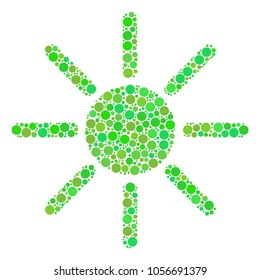 Sun collage of dots in different sizes and green color tinges. Vector dots are organized into sun composition. Freshness design concept.