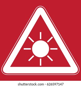 Sun danger sign on red background