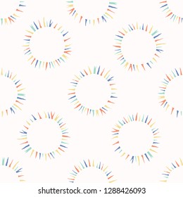 Sun flare confetti polka dot vector pattern. Hand drawn repeating all over print. Abstract kawaii rainbow circle illustration for trendy fashion prints, kids room home decor background.