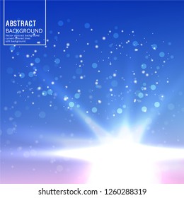 Sun Glare on Soft Blue Background. Abstract Background with Bokeh Effect.