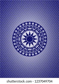 sun icon with denim texture