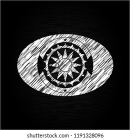 sun icon drawn on a blackboard
